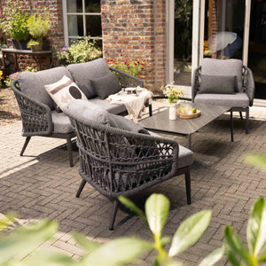 Styled Florence rope outdoor furniture set with chairs, sofa, and table on a patio