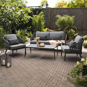 Garden view of Florence rope weave outdoor seating with center table for outdoor spaces
